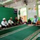 Sertu Mugeni, Babinsa Koramil 1003-01/Telaga Langsat, Kodim 1003/HSS saat mengikuti peringatan Isra Mi'raj bersama warga.