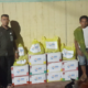 BRI Cabang Kandangan menyerahkan bantuan musibah banjir bandang kepada Kepala Desa Malinau secara simbolis.