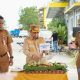 Bupati Tapin H. Yamani melakukan pemotongan tumpeng di peringatan HKN ke-61. (Foto : Prokopim Tapin)