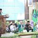 Bupati HSS H. Syafrudin Noor memberikan sambutan pada acara Harlah ke-80 Muslimat Nahdlatul Ulama. (Dok. Prokopim HSS)